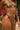 Person wearing a colorful bikini with floral patterns in an outdoor setting