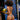 Woman in a bikini holding a coconut against a blue background