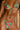 Person wearing a colourful bikini with floral and watermelon design.