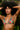 Woman wearing a floral bikini top with a tropical background