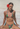 Woman in a colorful bikini with a red flower in her hair.