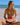 Woman in a bikini holding a watermelon slice on a beach